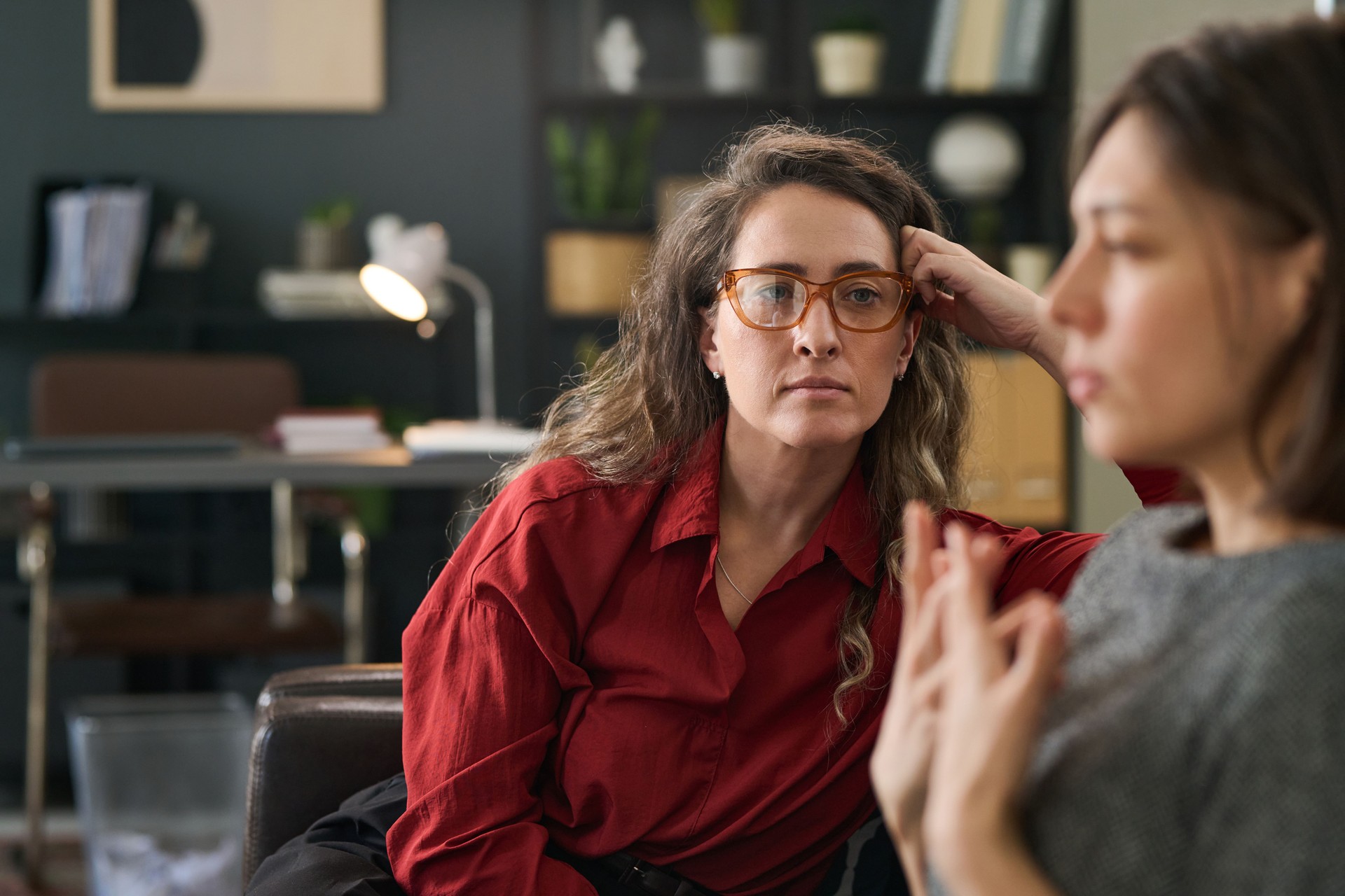 Counselor Listening to Client in Office Setting